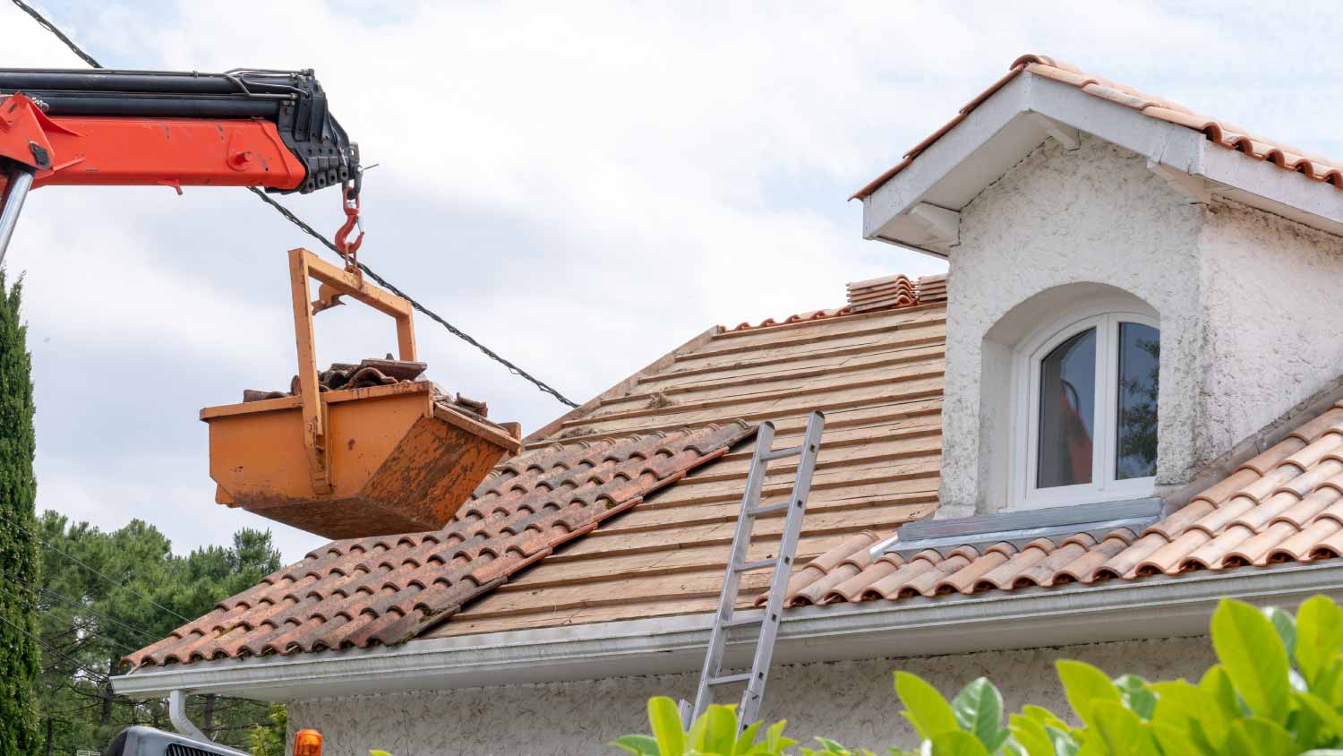 Roof of house with high dump on building site