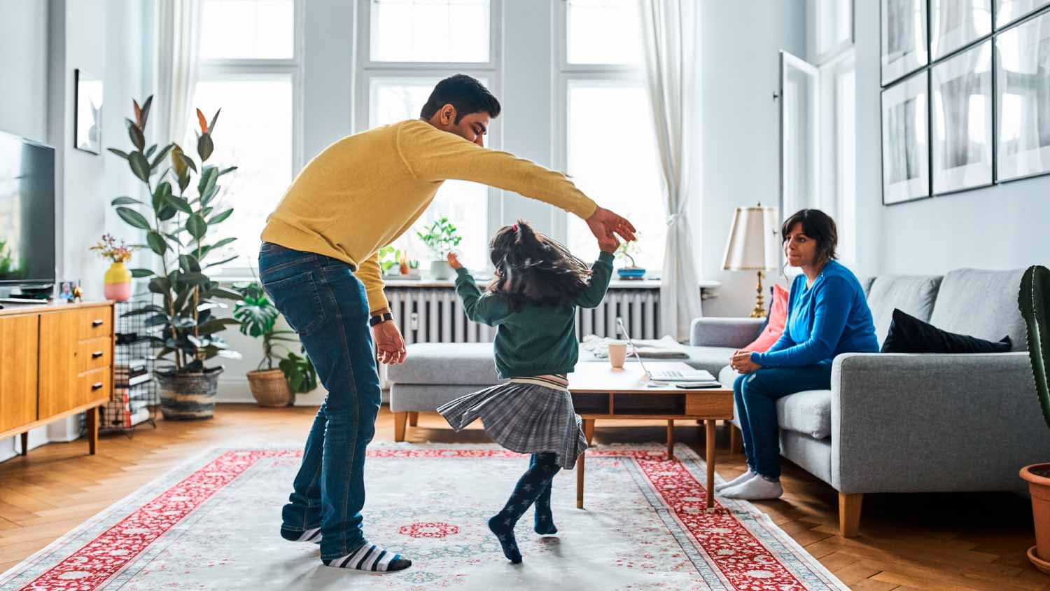 Little girl dancing with her dad