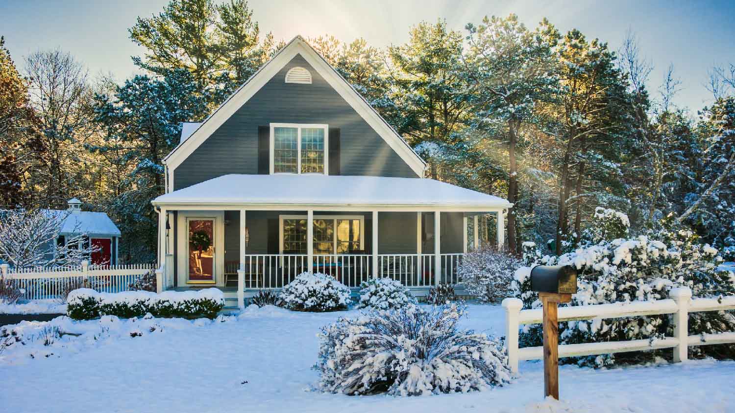 The exterior of a house on a snowy day