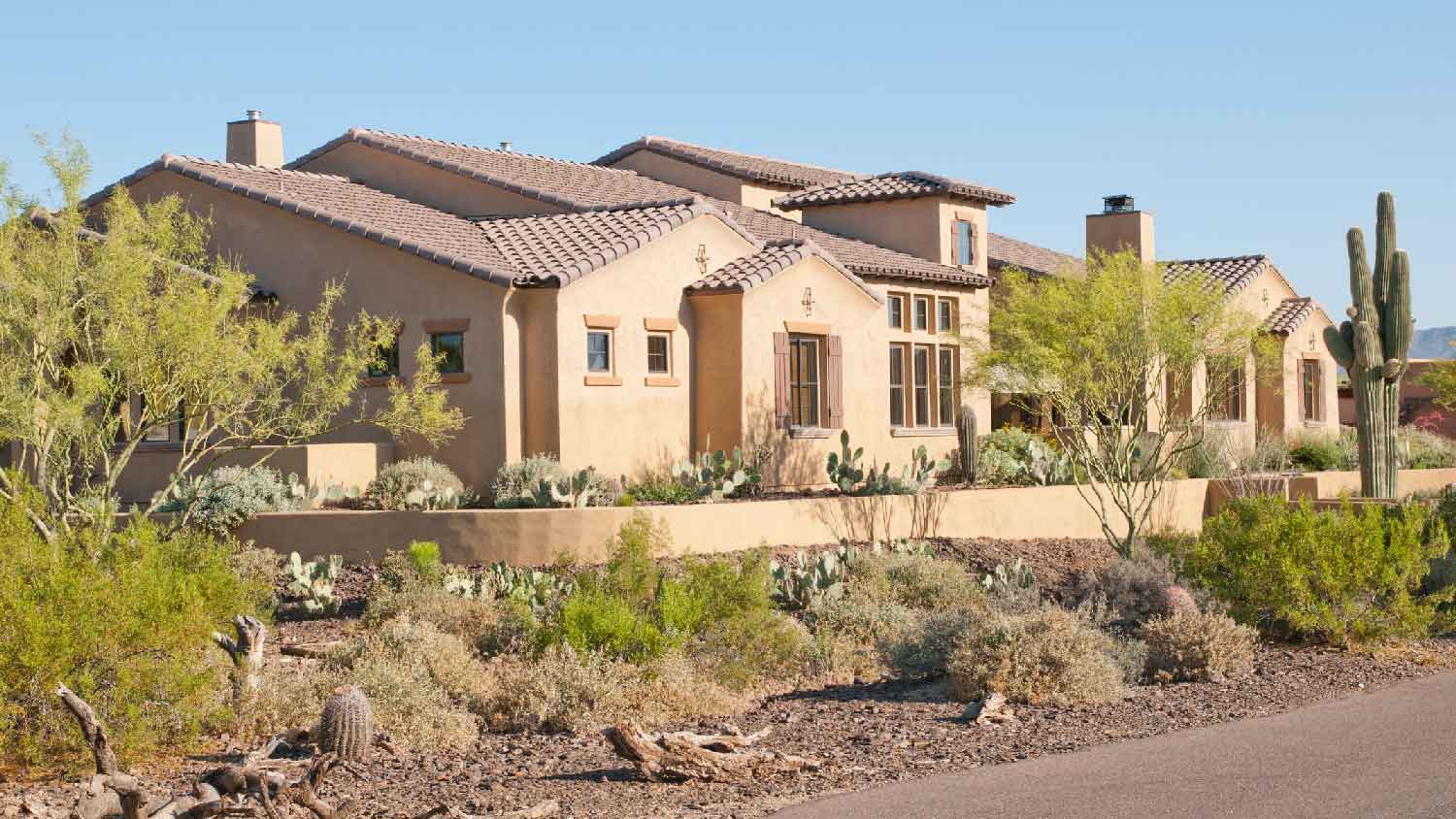 A house with a desert landscaped garden