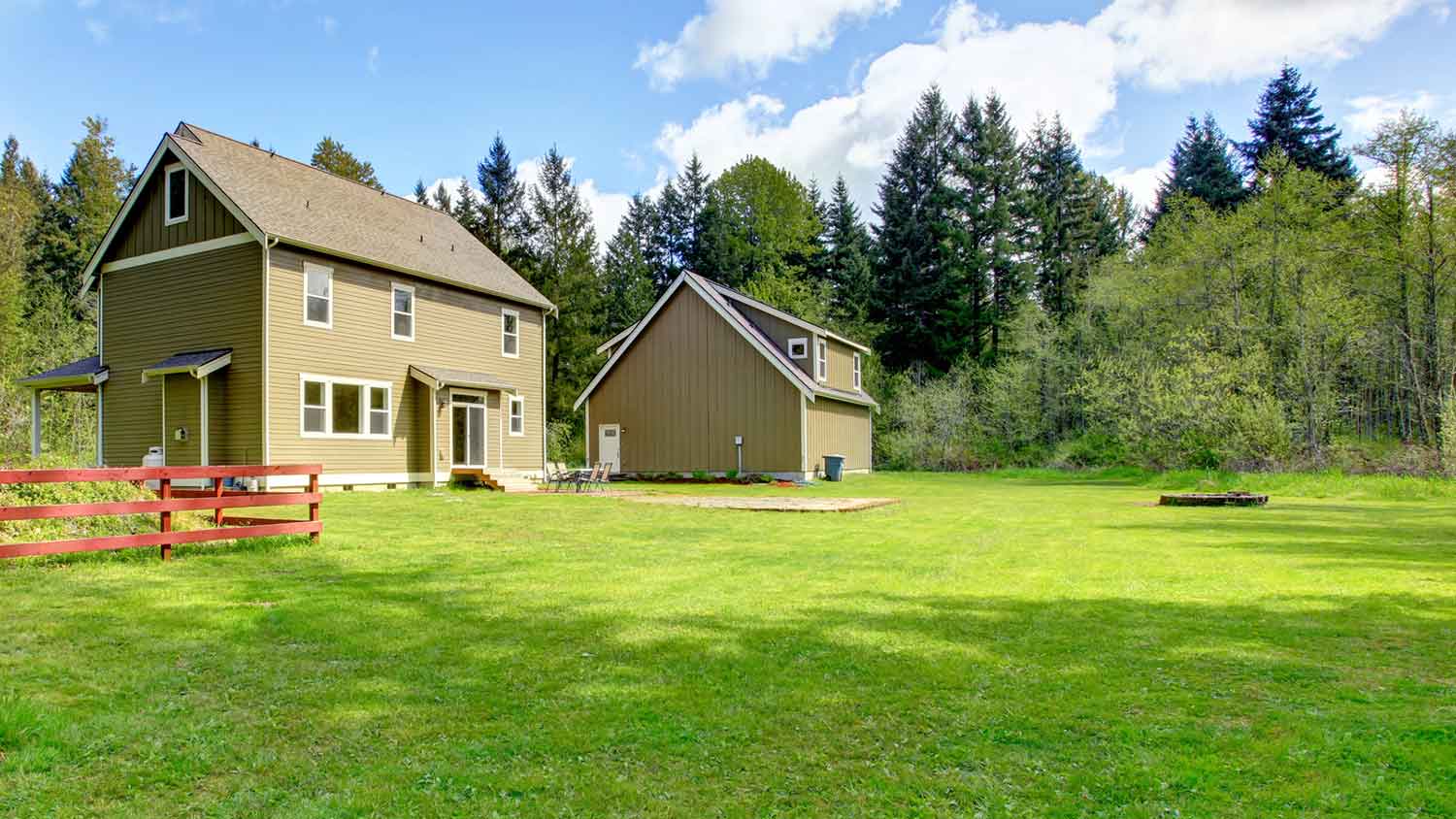 Country house surrounded by a large field