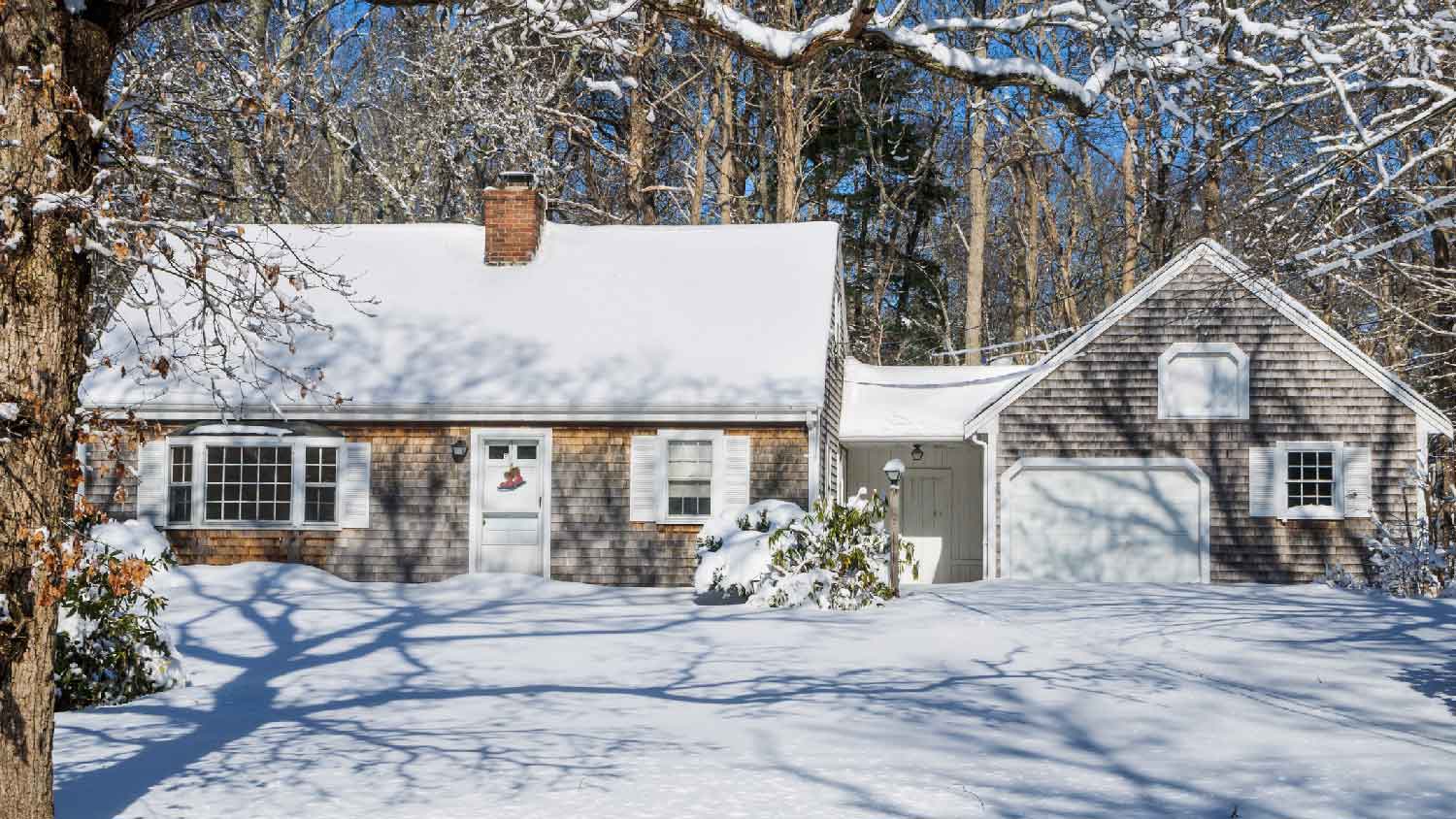 A cozy house covered in snow