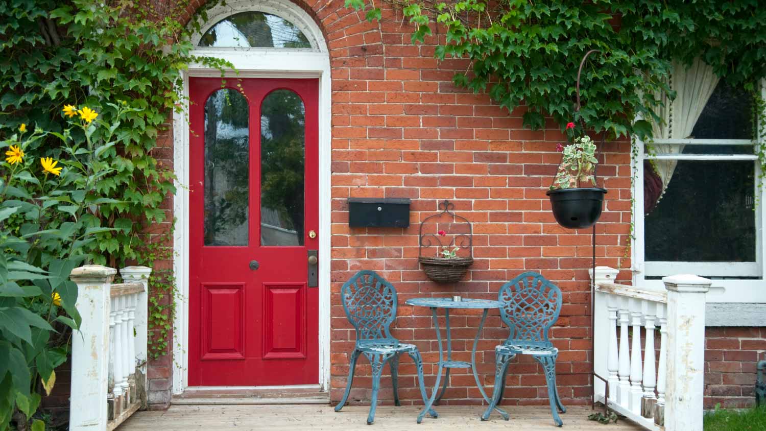 Red outside door with a patio