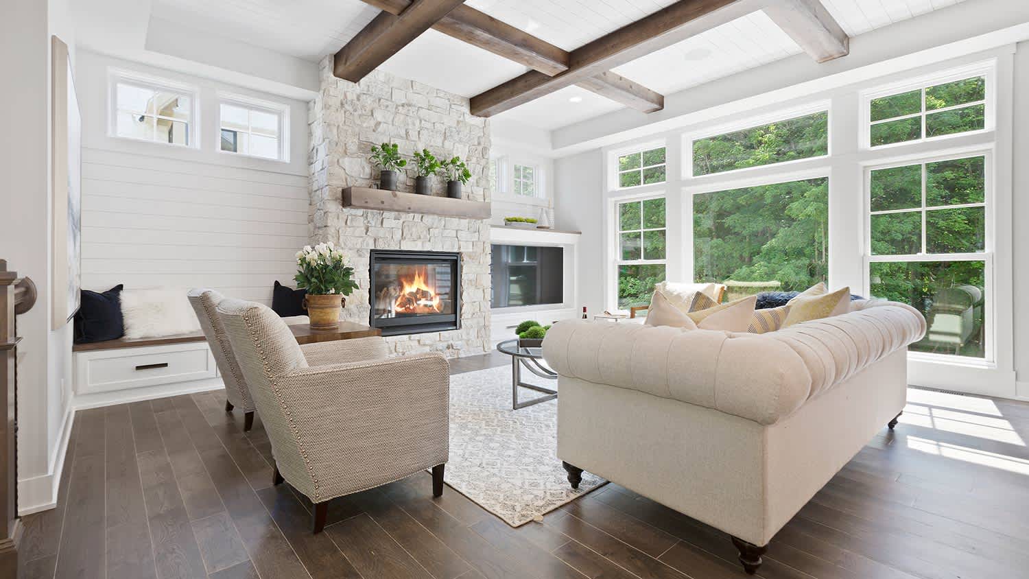 Family room with fireplace with stone surround