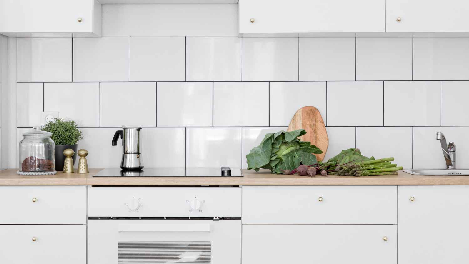 Kitchen interior with white tiles
