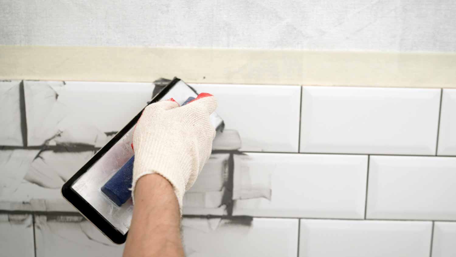 White tile in the kitchen with gray grout