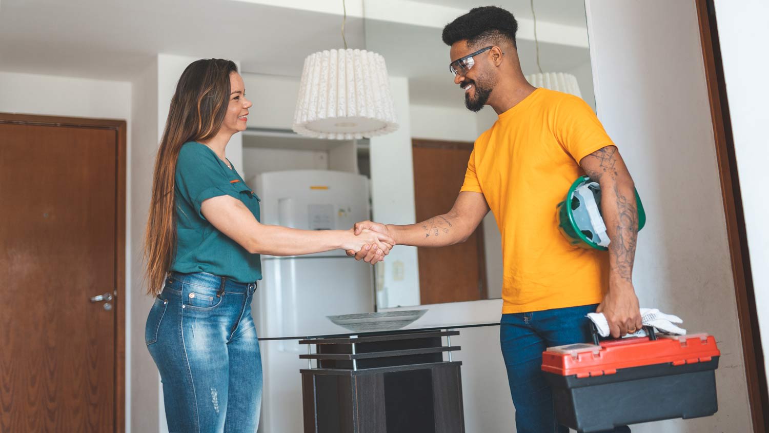 electrician shaking hands with customer after job done