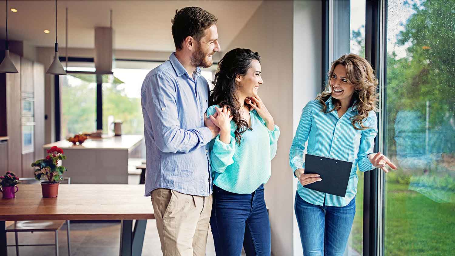 Landscape designer talking with young couple