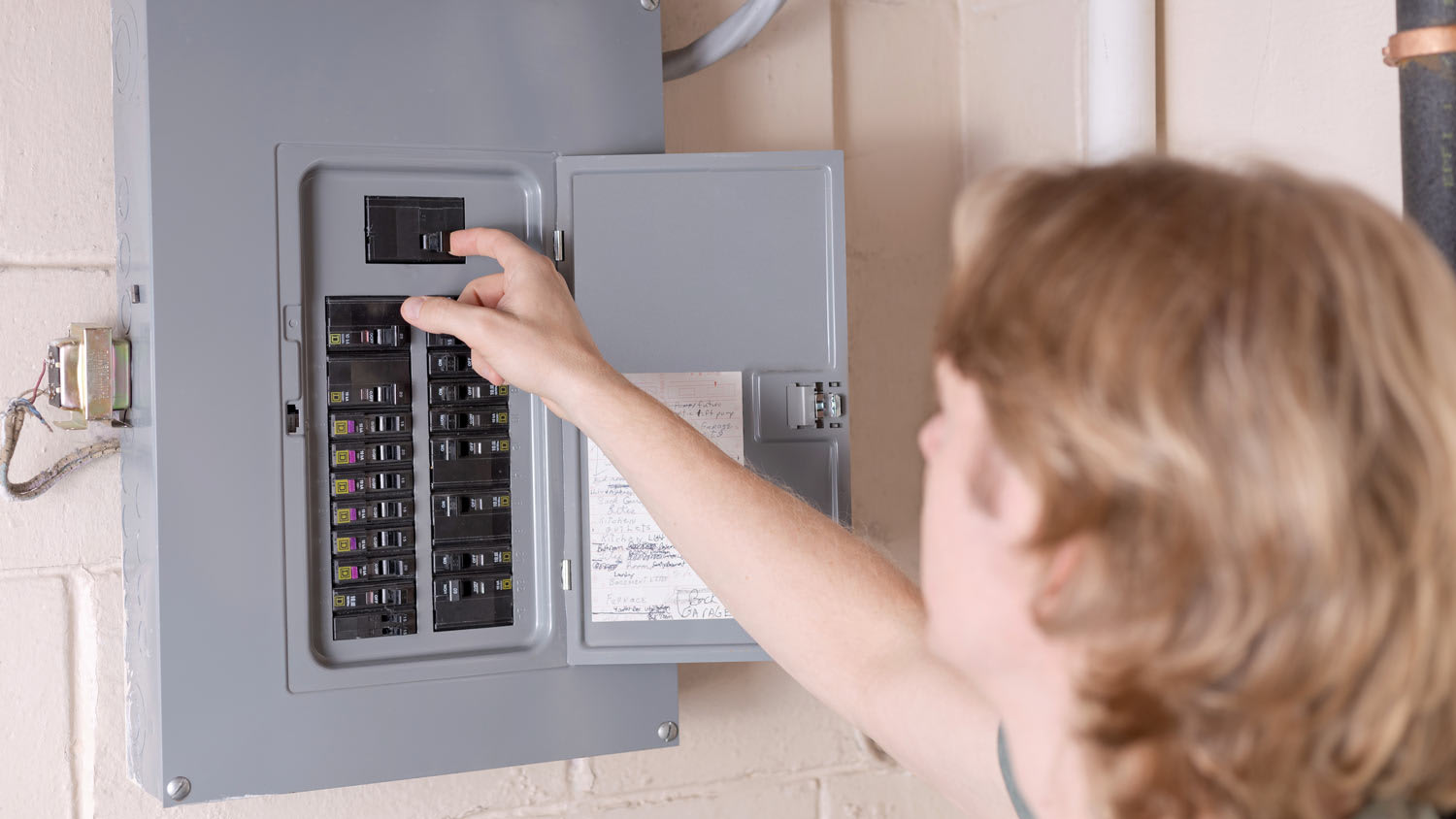 man shutting off power