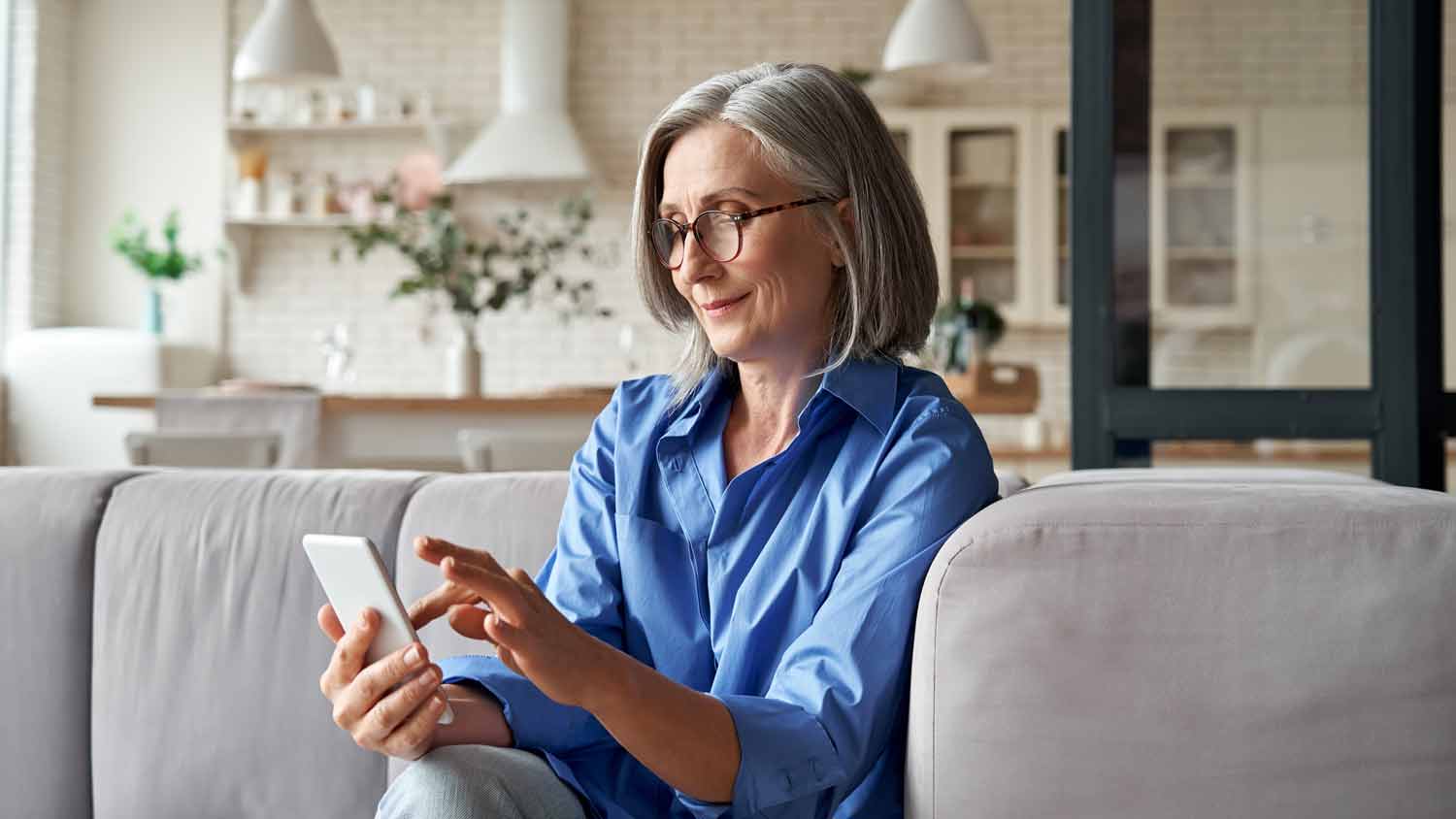 older woman looking at her phone