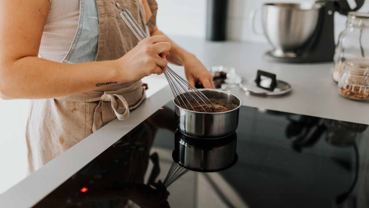 Woman in kitchen preparing food
