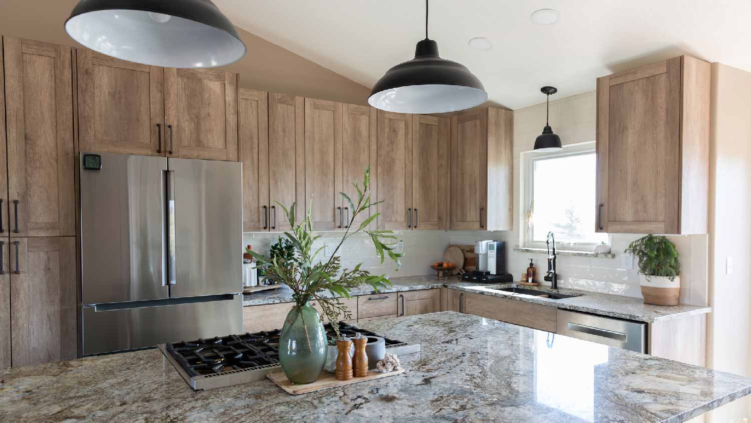 A kitchen with granite countertop