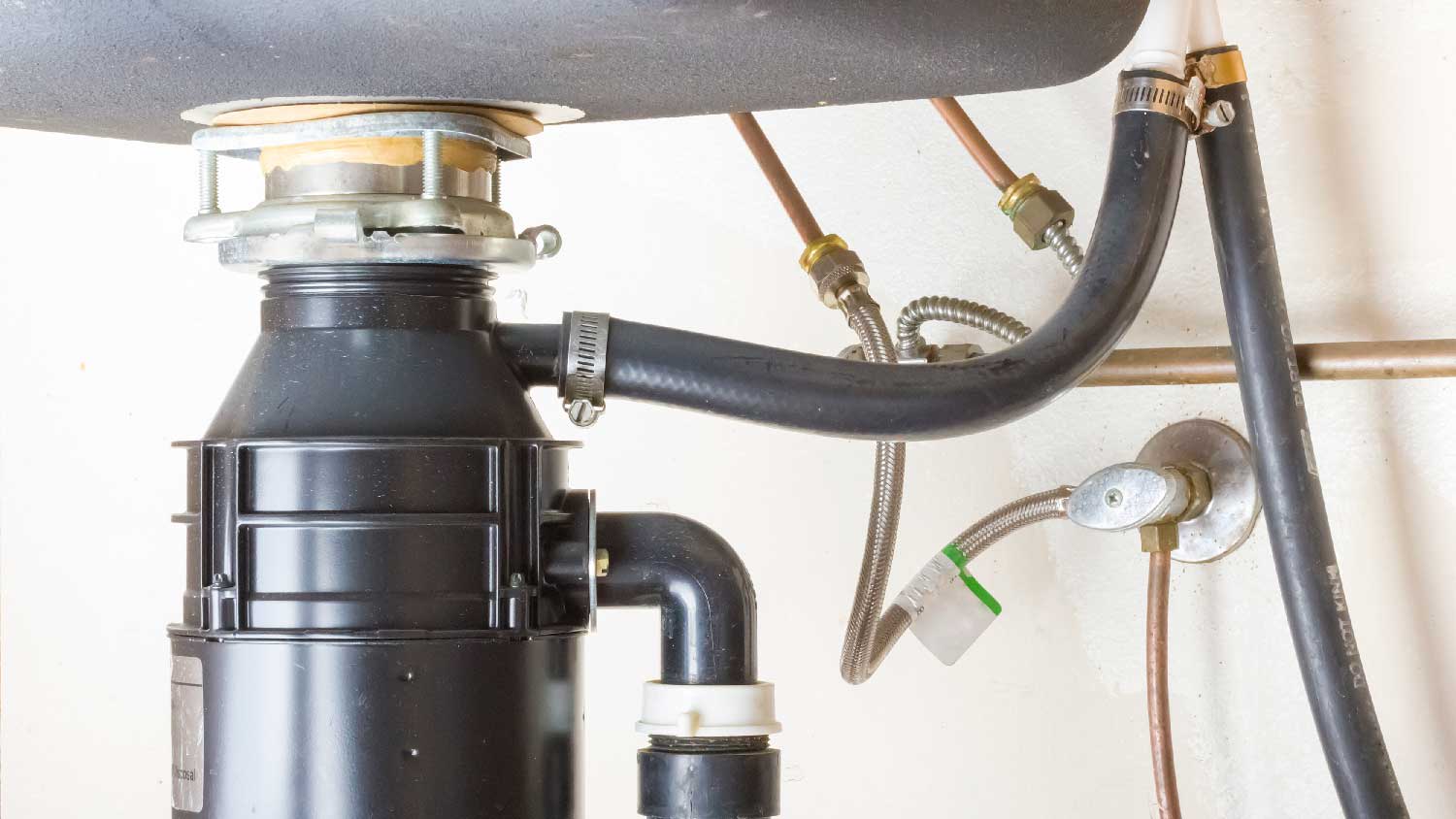 A garbage disposal under a sink