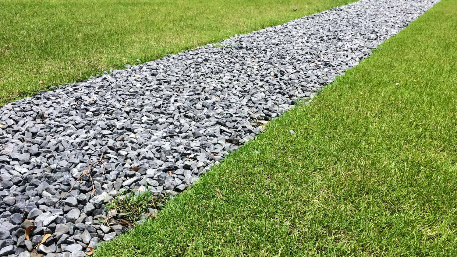 Gray gravel french drain