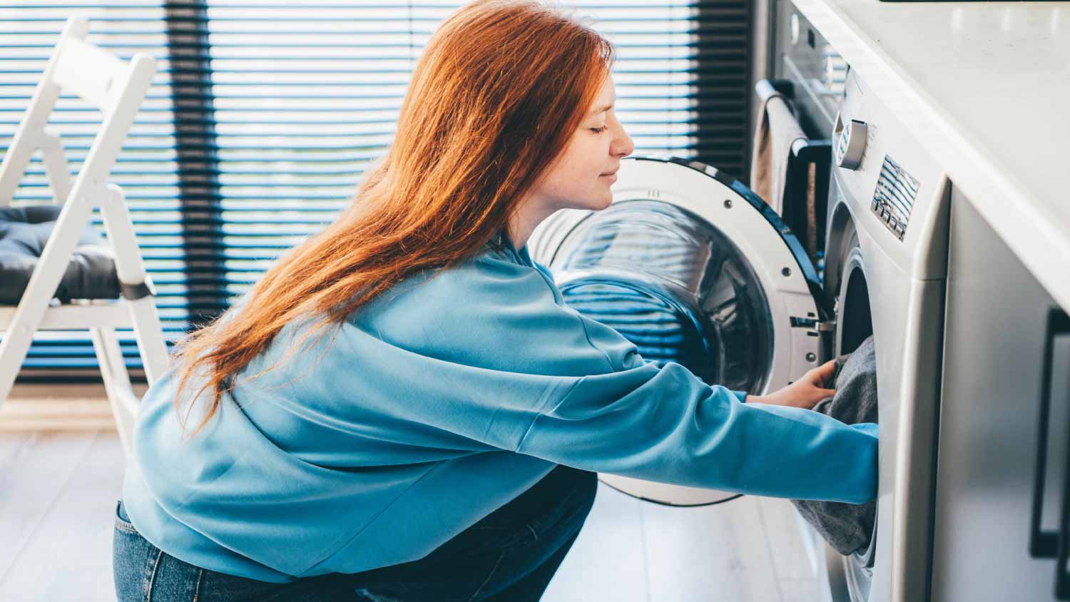 Woman doing laundry at home