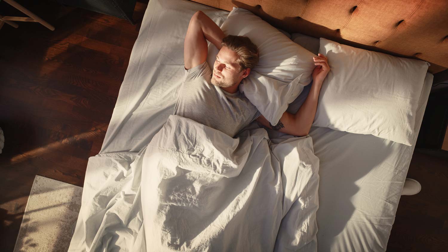 man laying on bed at home