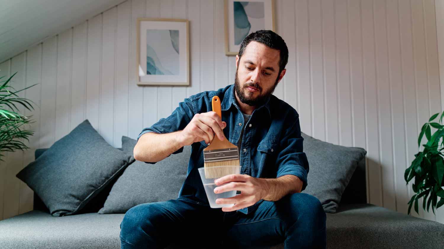 Man washing paintbrush