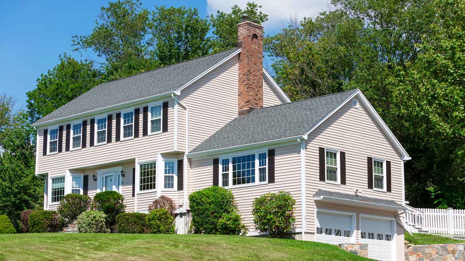 Suburban house on a hill with open gable roof
