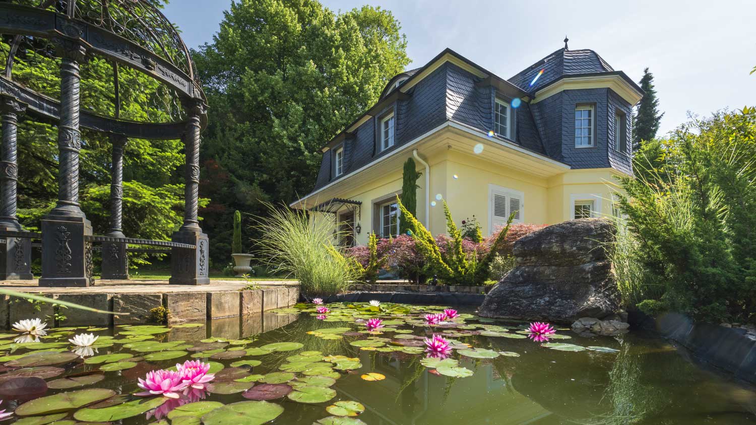 Art nouveau villa, 1929 with a lily pond