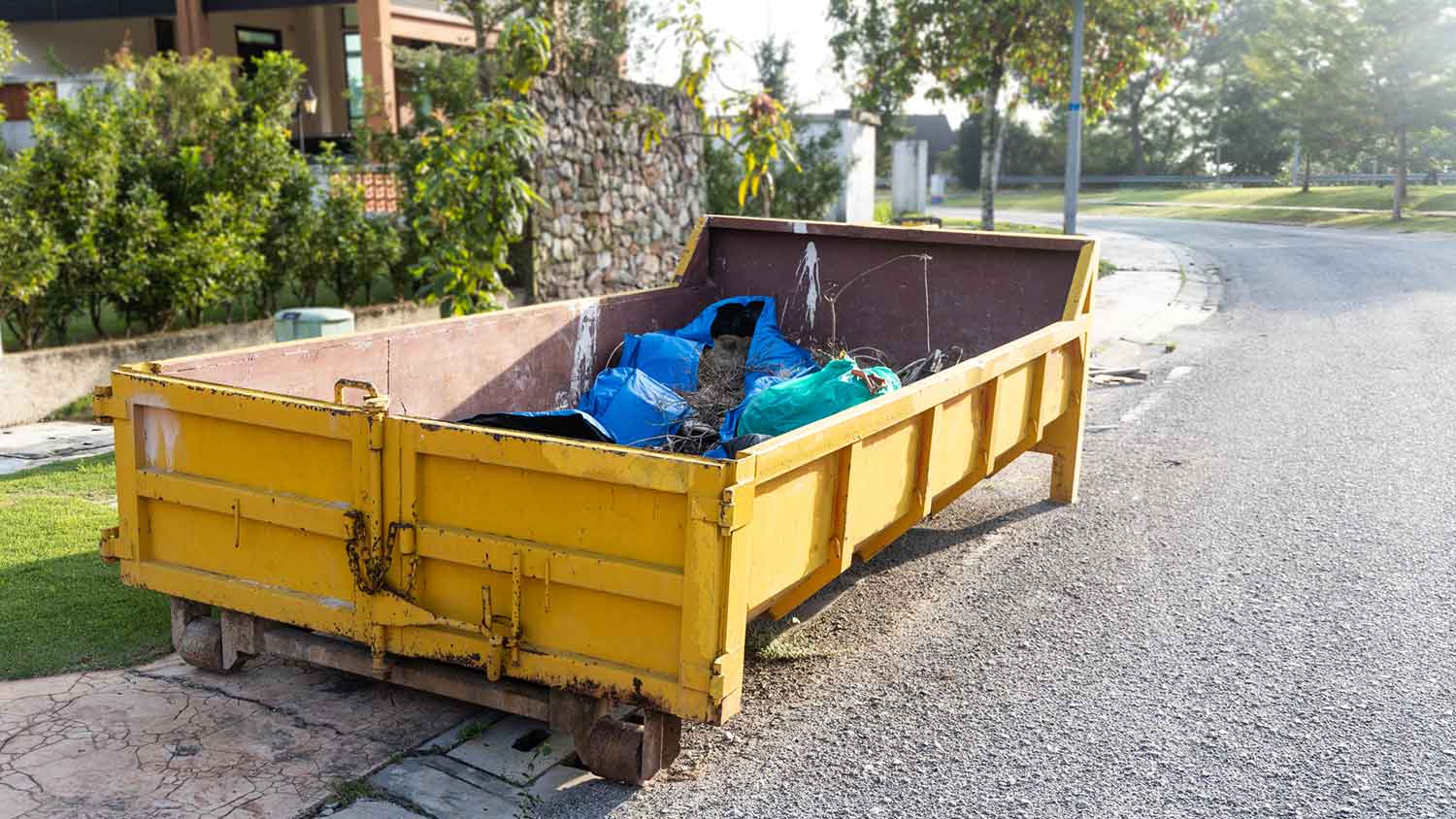 Dumpster rental sitting on the curve