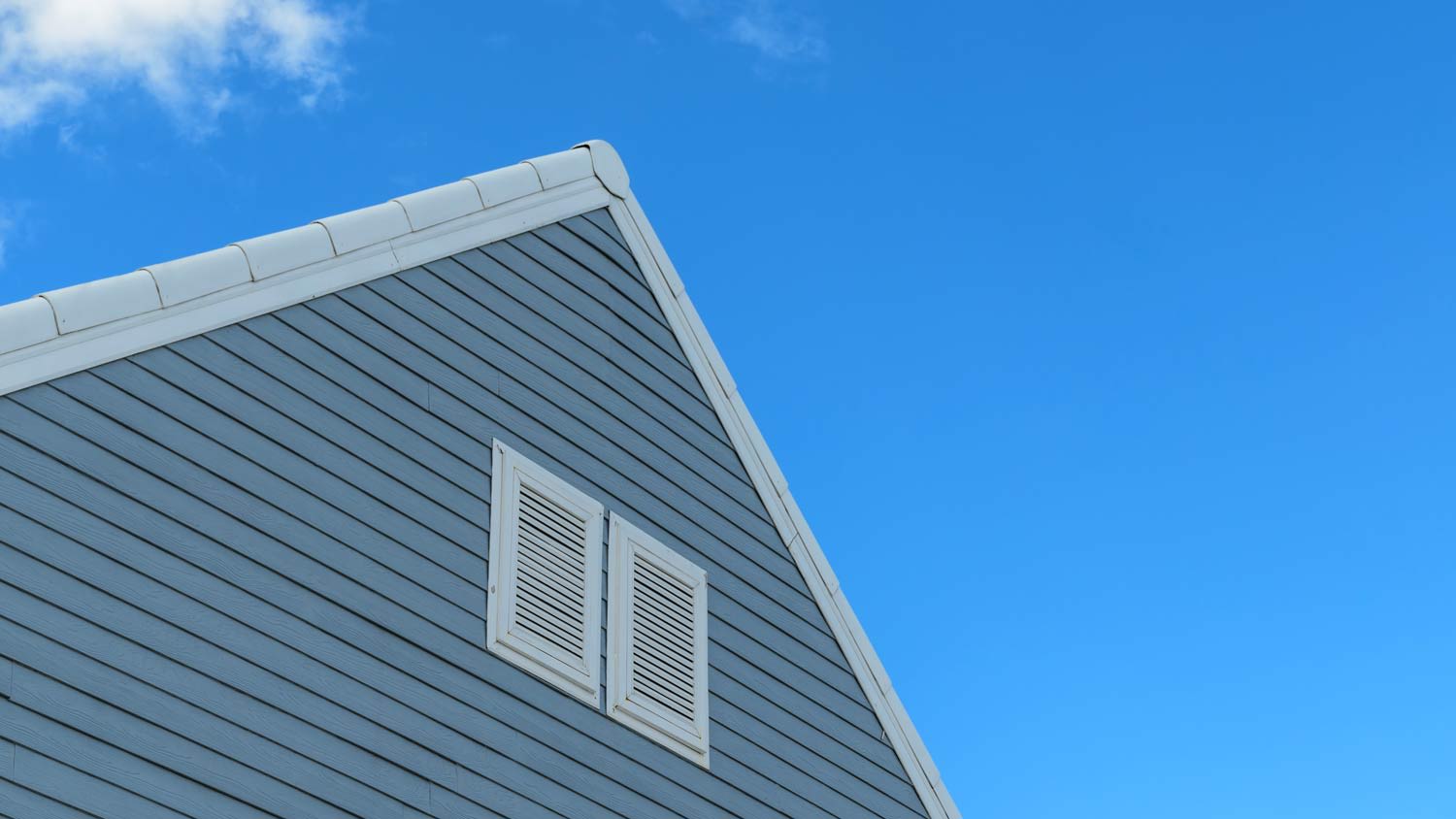 blue house with air filtration vent