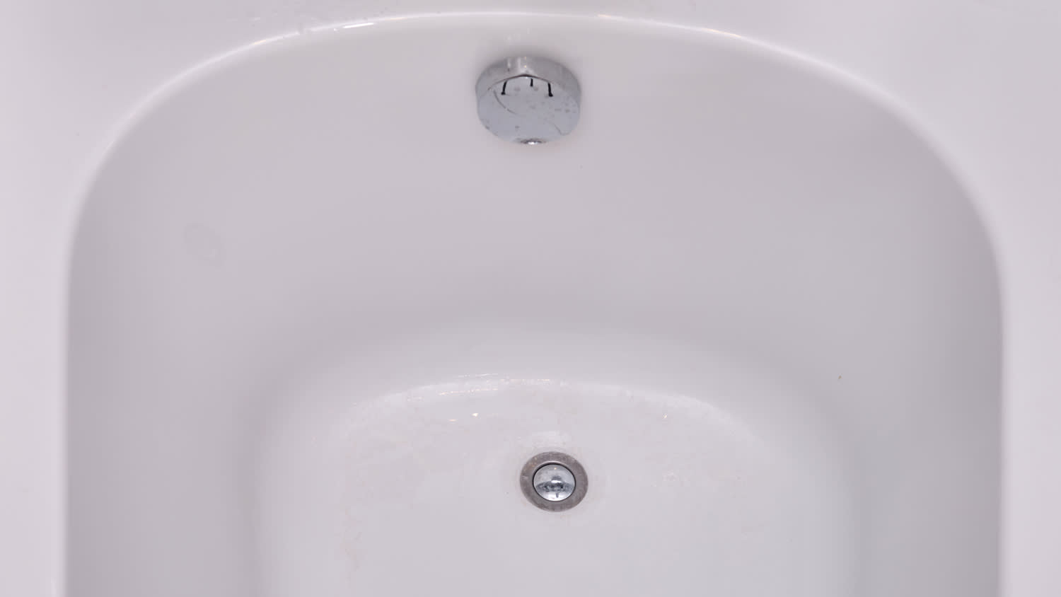 clean bathtub with drain