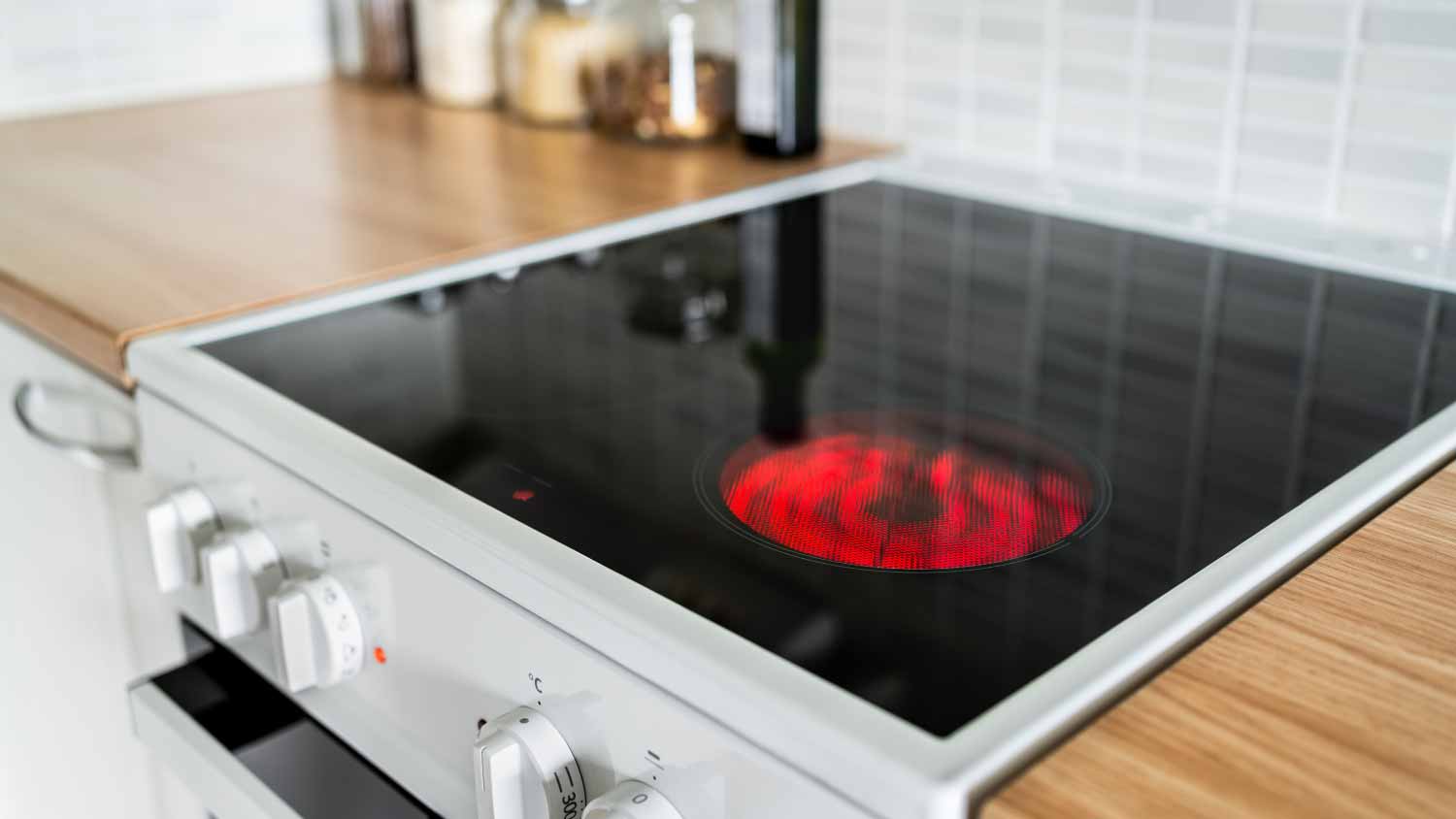 Electric stove and hob in kitchen
