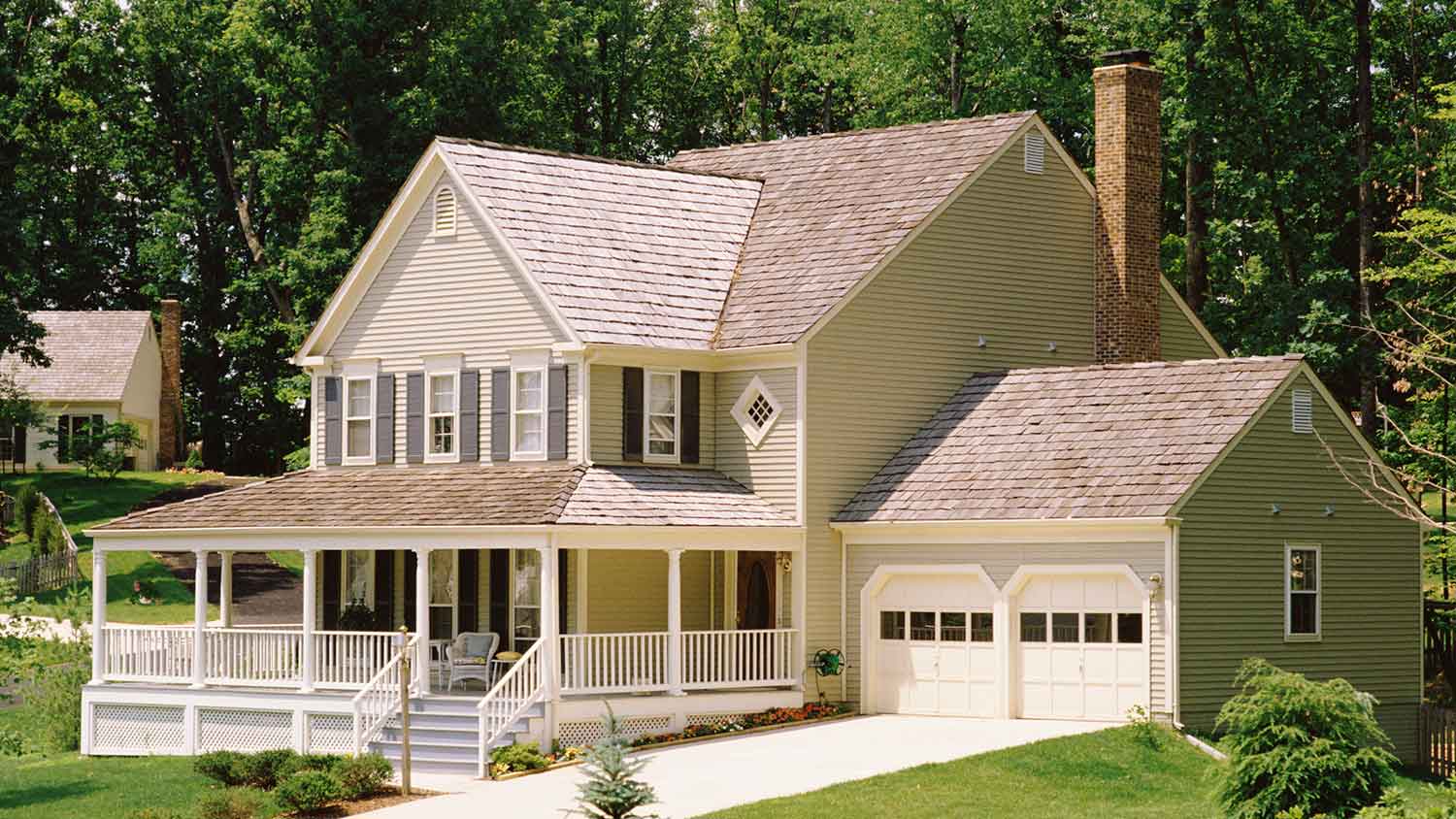 Farmhouse style home with gable roof and front porch