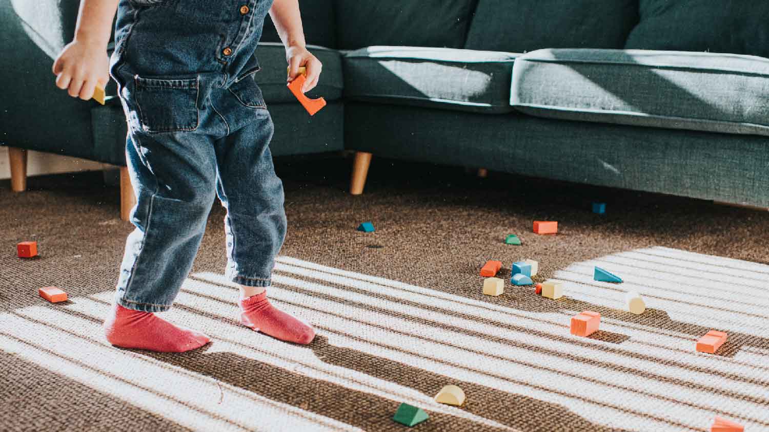 A kid playing on nylon carpet