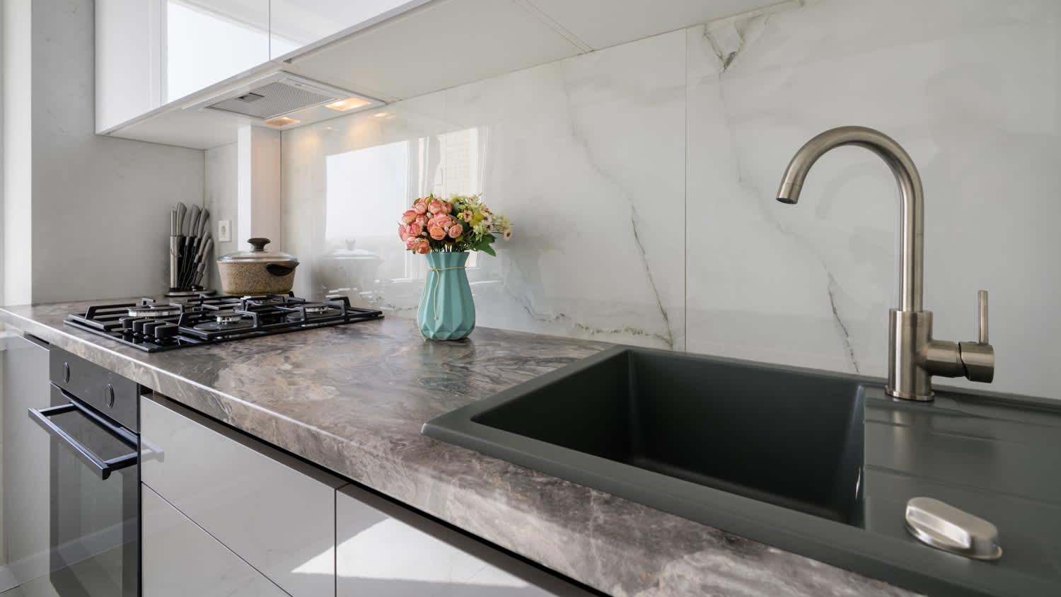 white modern kitchen with quartz sink
