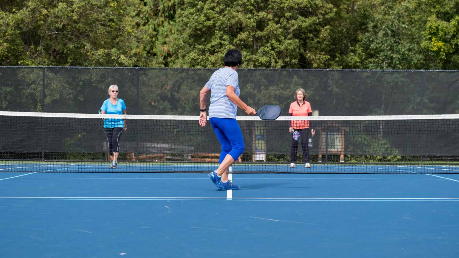 Women playing pickleball