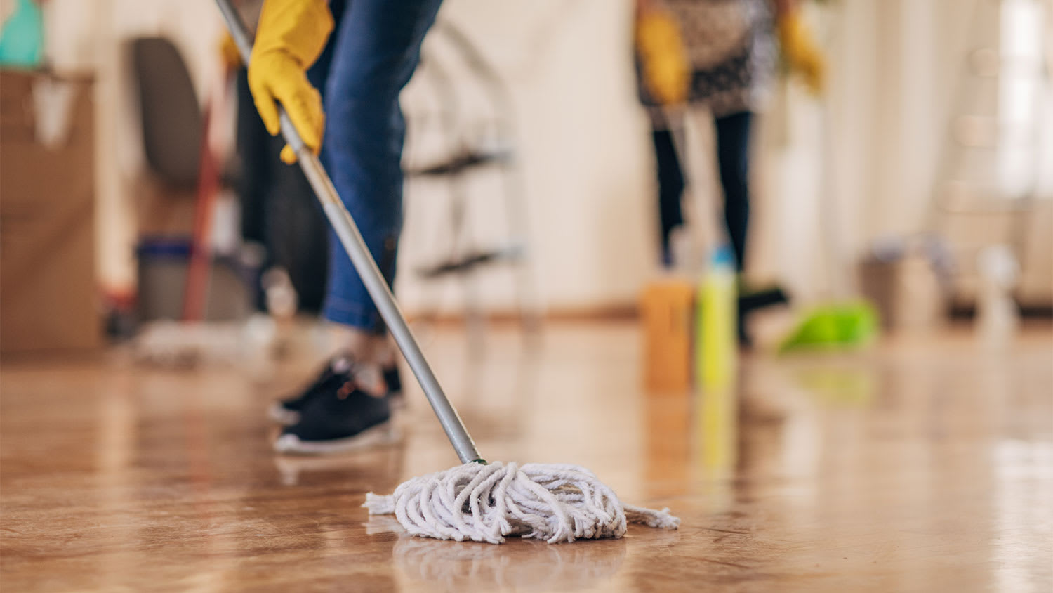 Cleaners mopping floor
