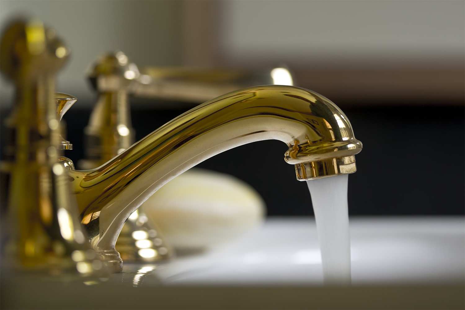 Close up of brass bathroom faucet