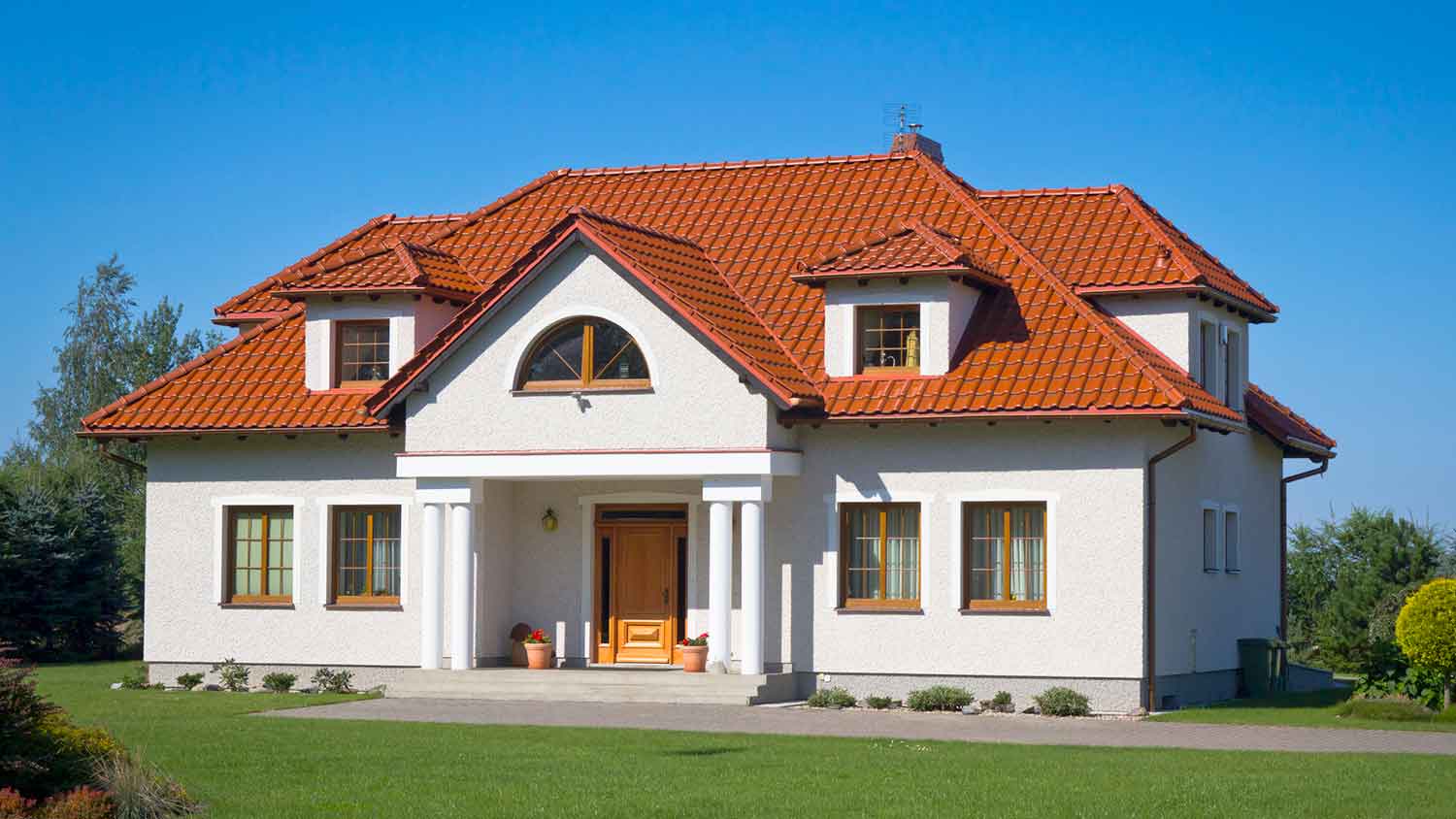 Red roof tile installed on a country house