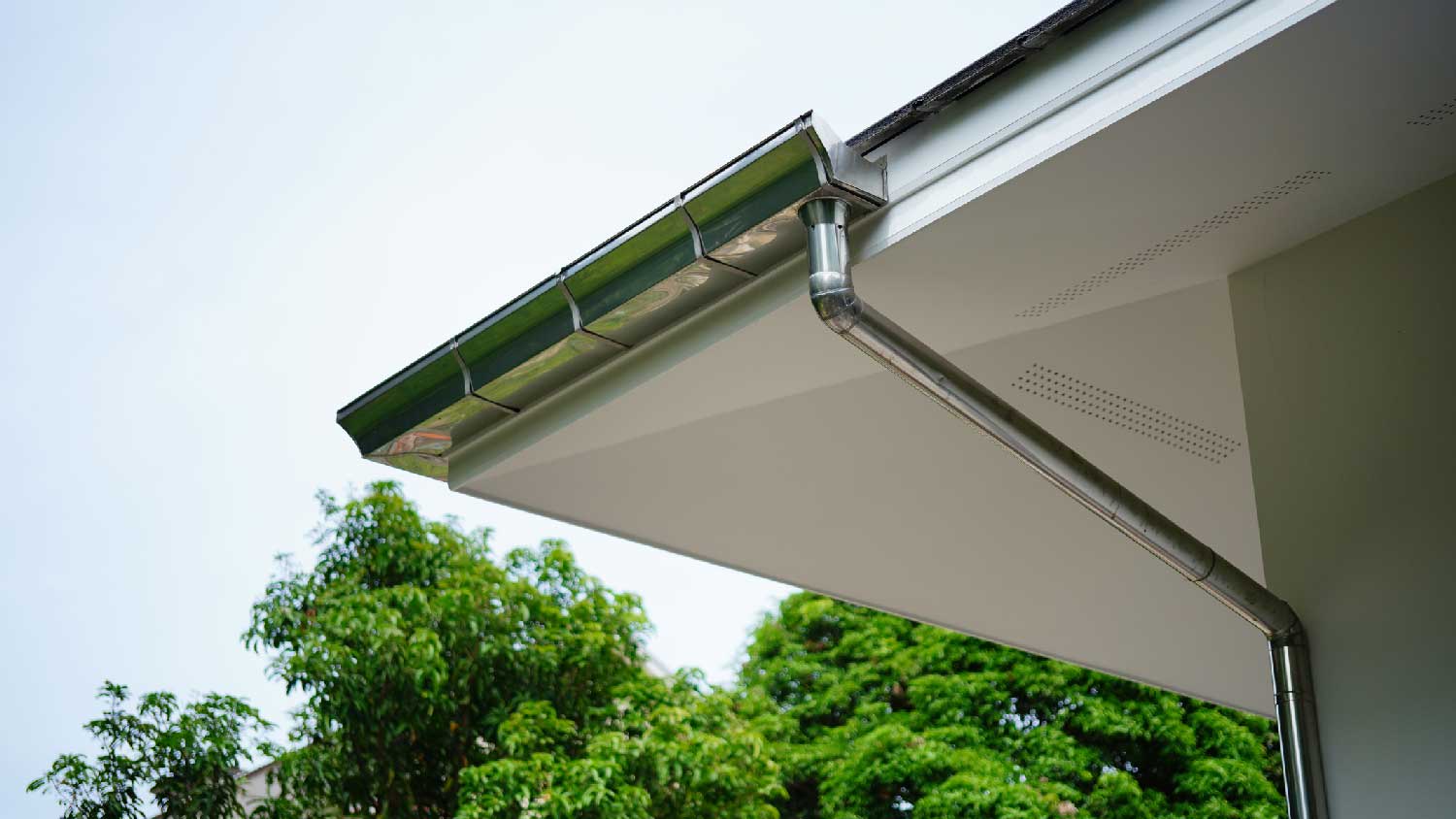 Aluminum gutters on the roof of a house