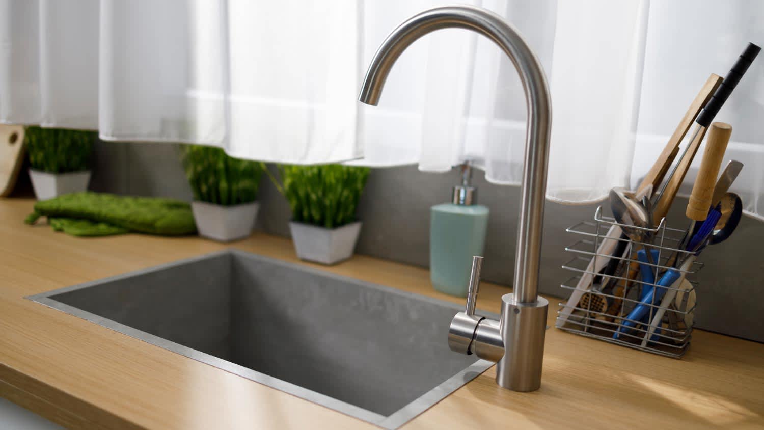 kitchen faucet with gray quartz sink