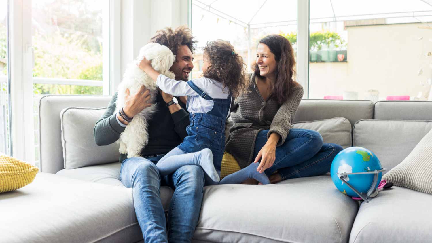 Family sitting together in living room