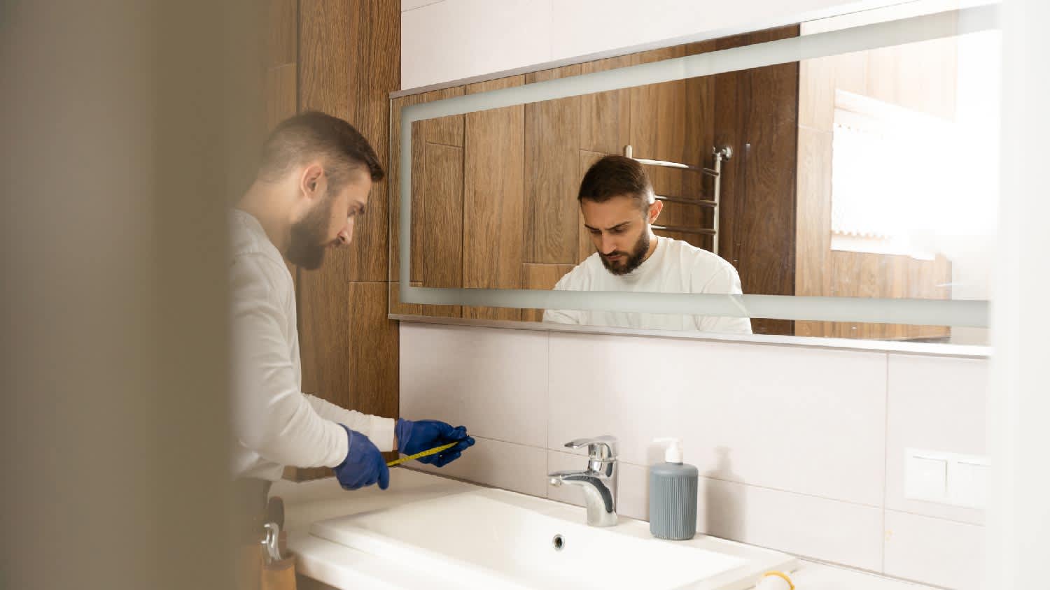 A handyman repairing a sink