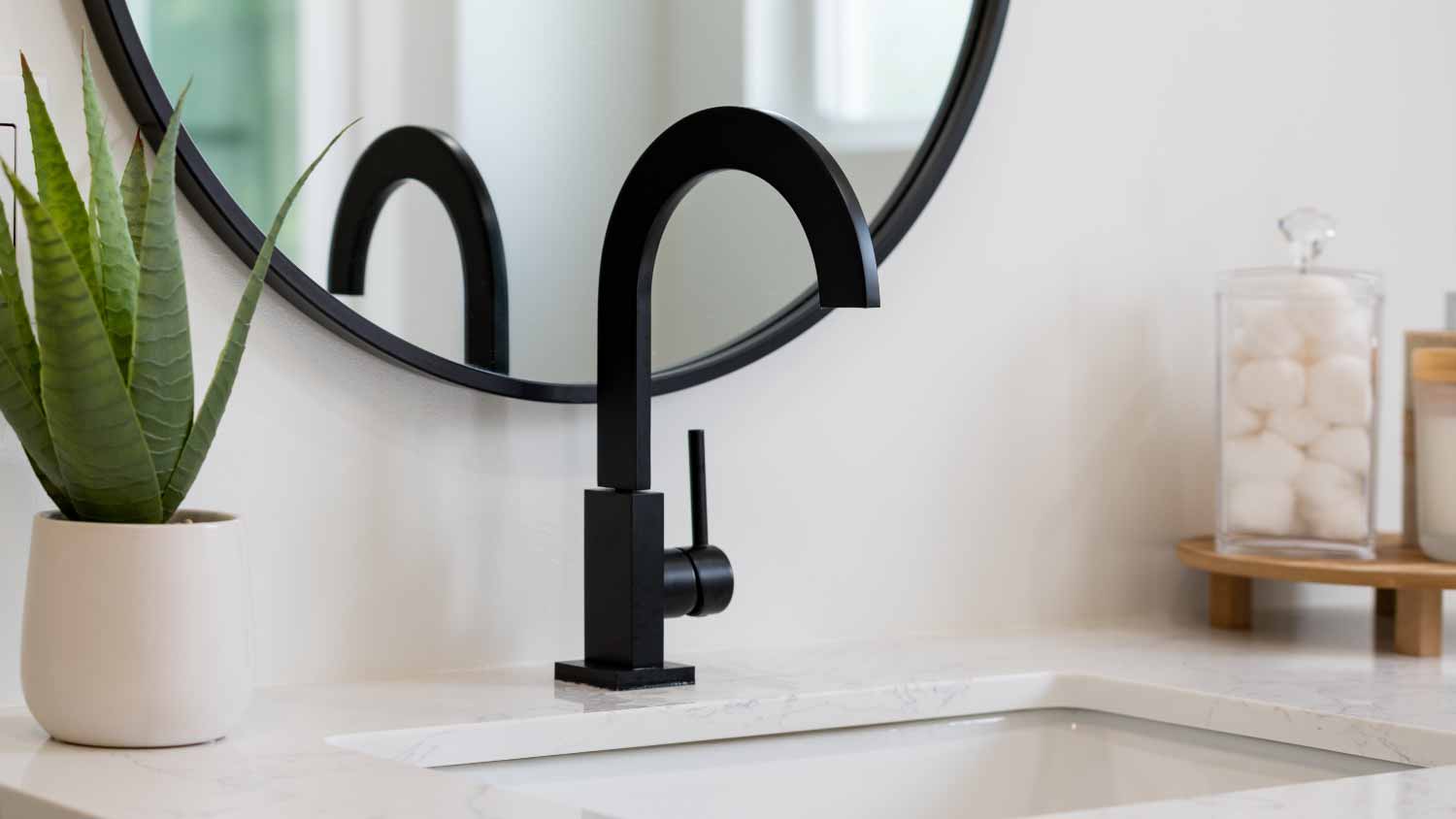 Bathroom details of sink with black faucet