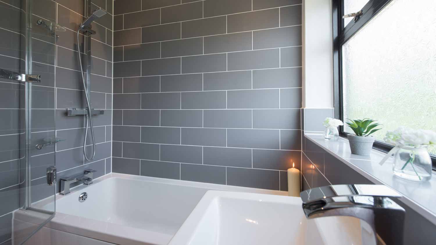Small gray tiled bathroom