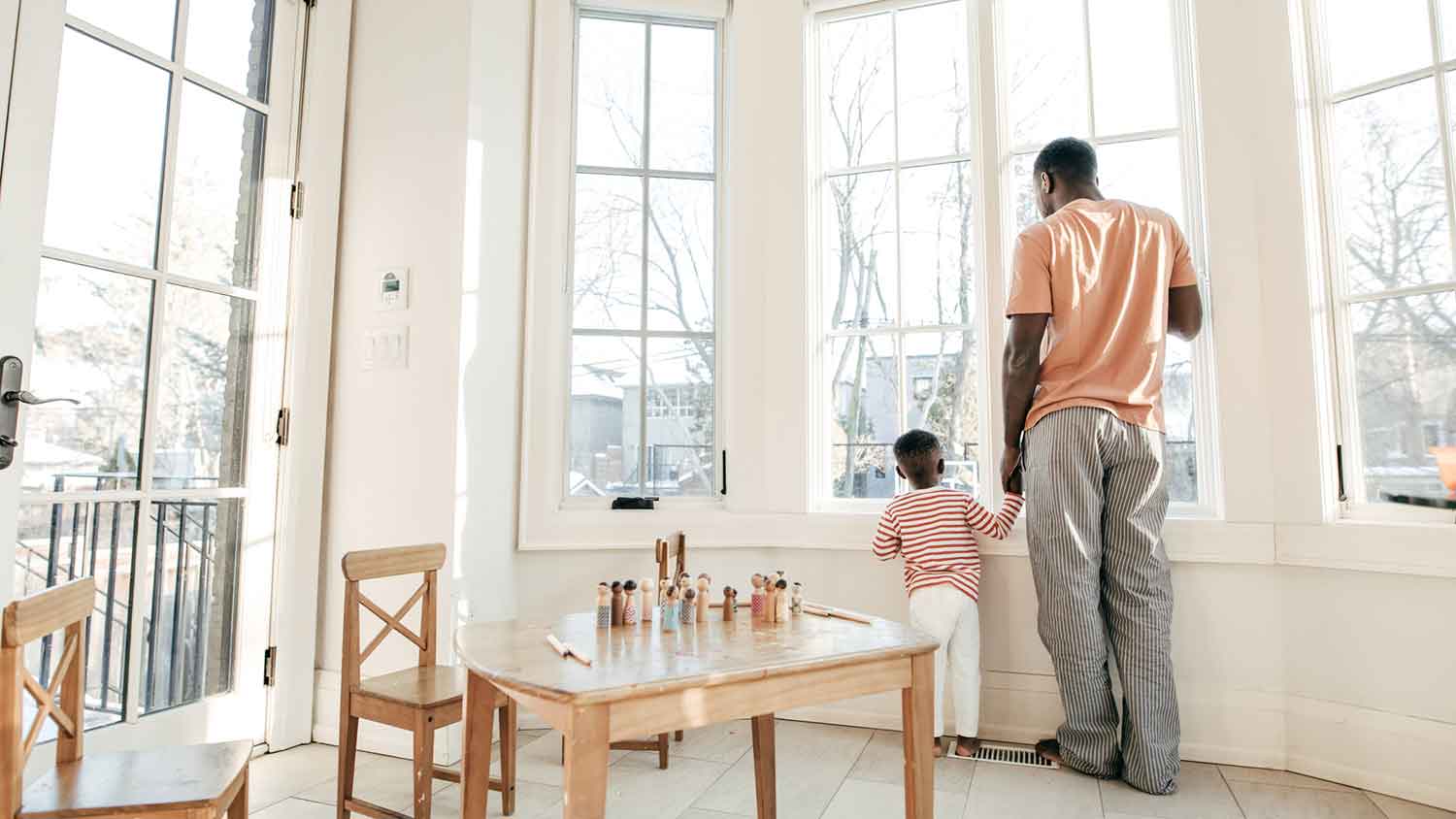 Father and son looking out the window