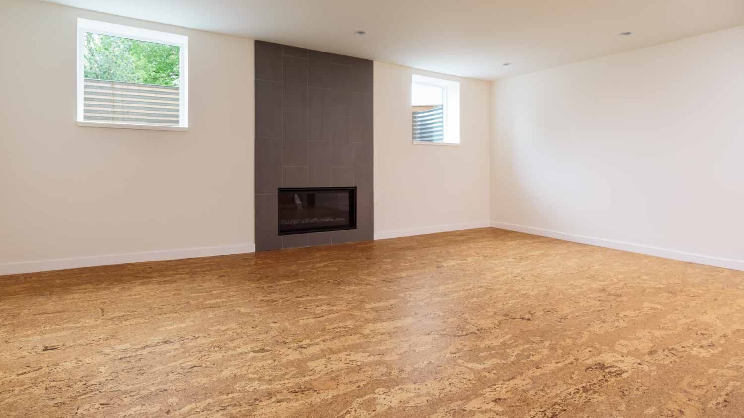 Room with cork flooring and fireplace