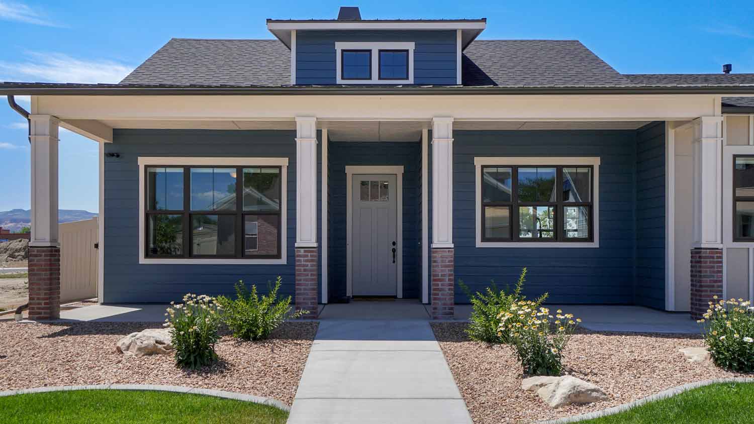 modern blue house with dark tinted windows