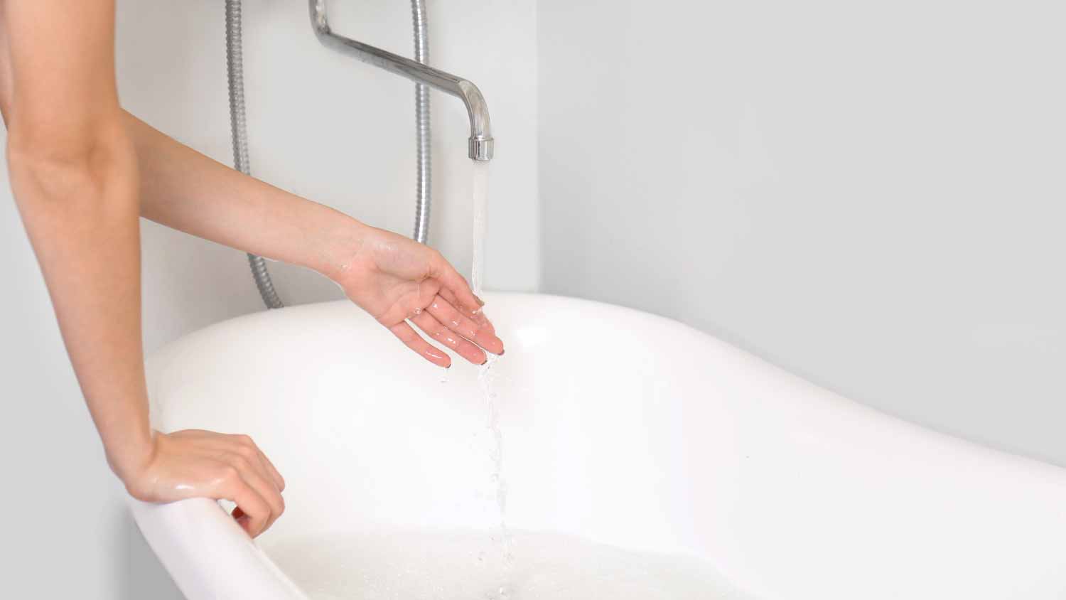 Woman running a bath