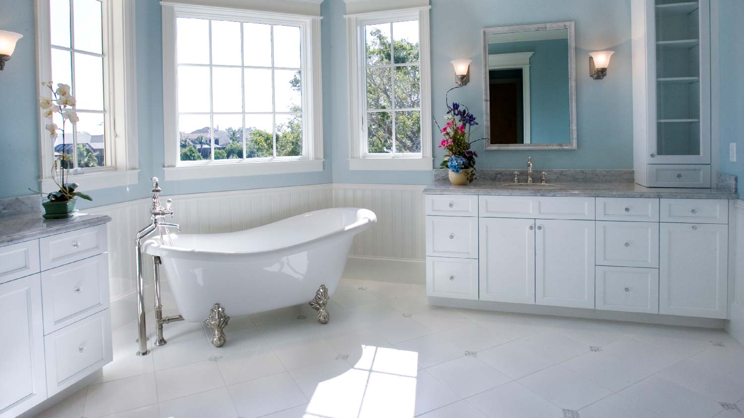 A free-standing soaking tub in a master bathroom