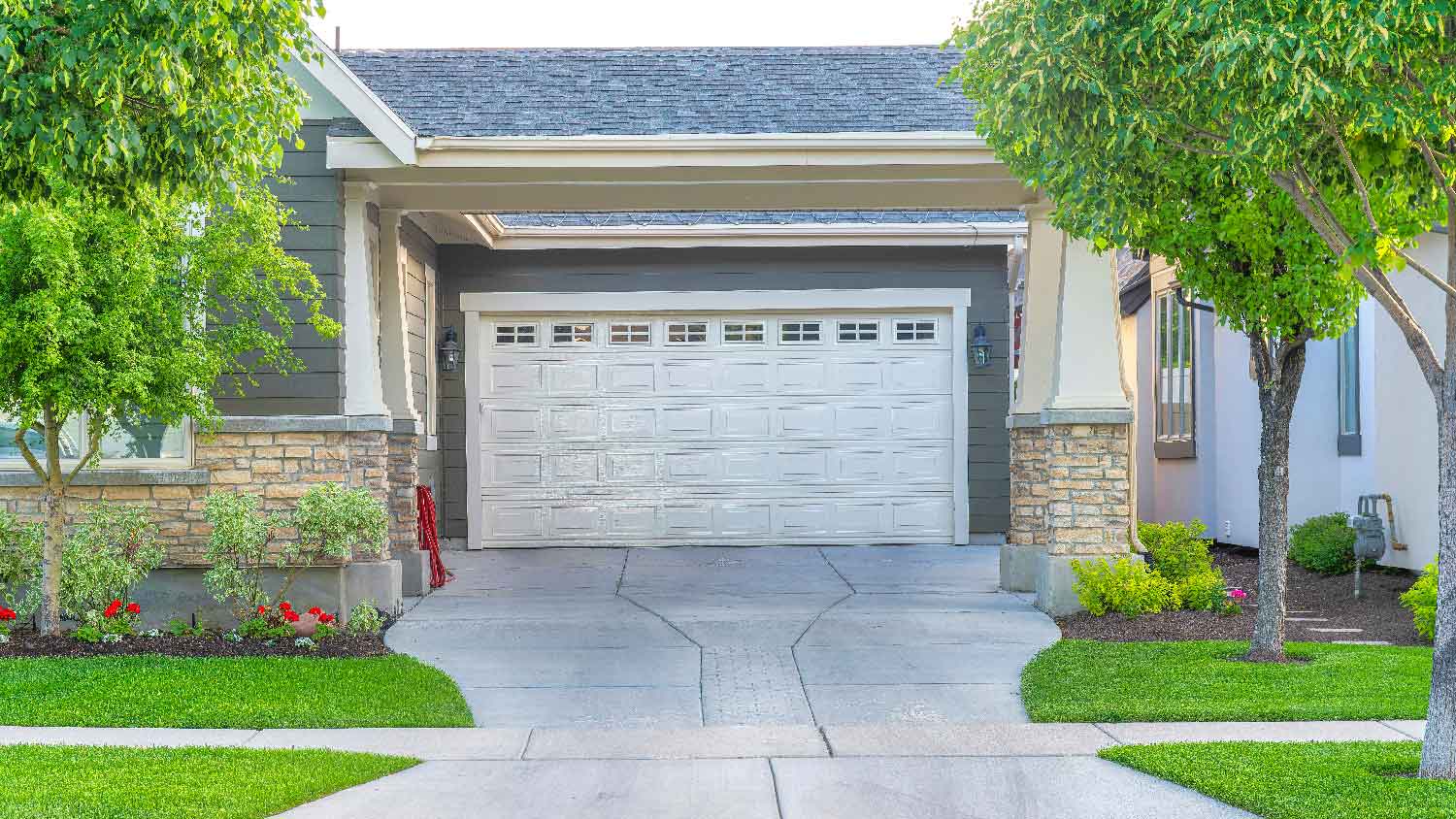 A concrete driveway on a beautiful house