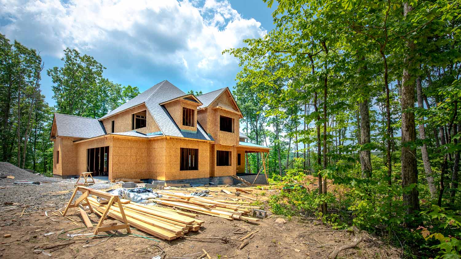 New home construction in peaceful woods setting
