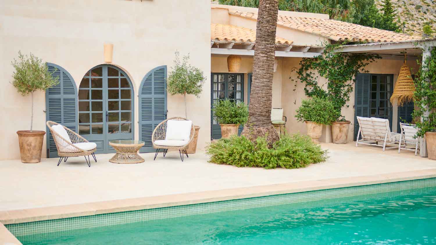 A beautiful pool in the backyard of a house