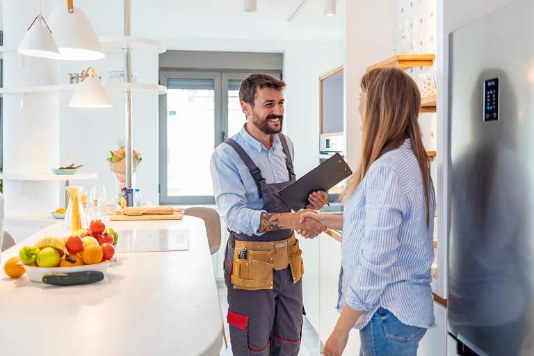 Contractor shaking hands with customer