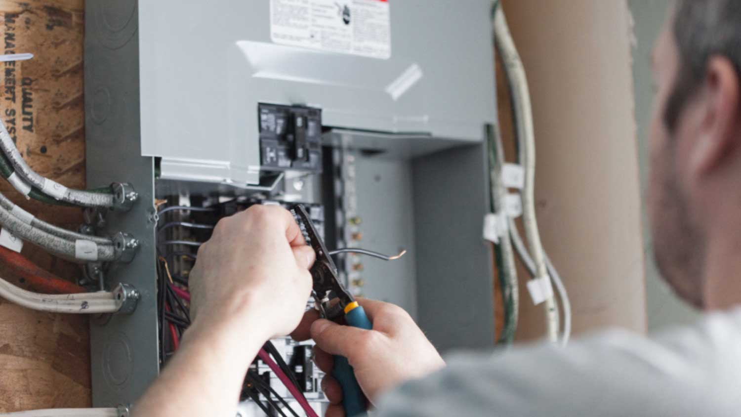 Electrician replacing the distribution board
